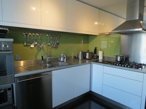 How to Improve Your Kitchen with a Glass Cooker Splashback 7 Image of glass kitchen splashbacks during an install
