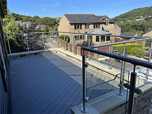 image of glass balustrade with handrail systems on decking